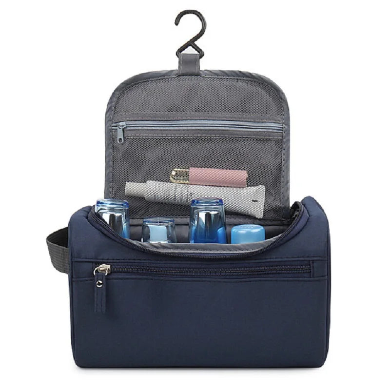 Blue toiletry bag with hanging hook, open to reveal items inside on a white background