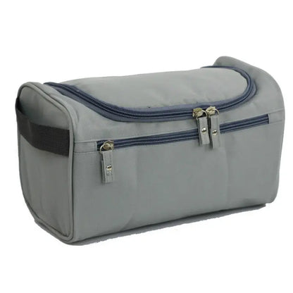 Gray toiletry bag with blue accents on a white background