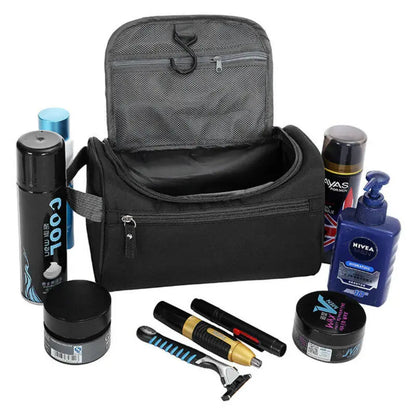 Grooming kit with a black bag, shaving tools, and personal care products on a white background