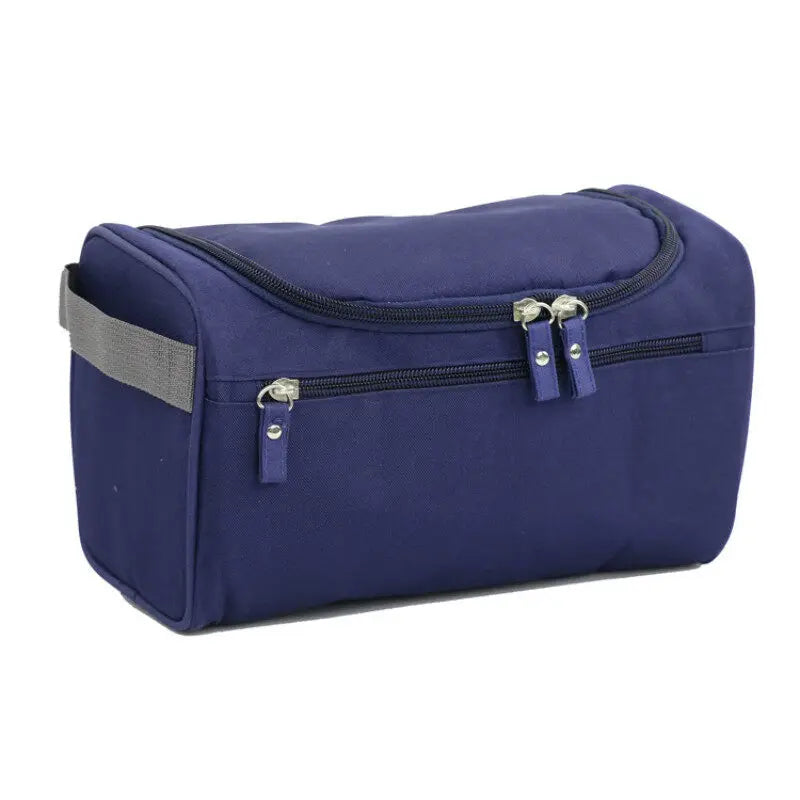 Navy blue toiletry bag with gray strap on a white background
