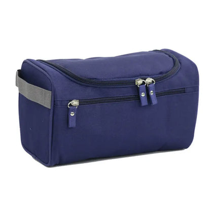 Navy blue toiletry bag with gray strap on a white background