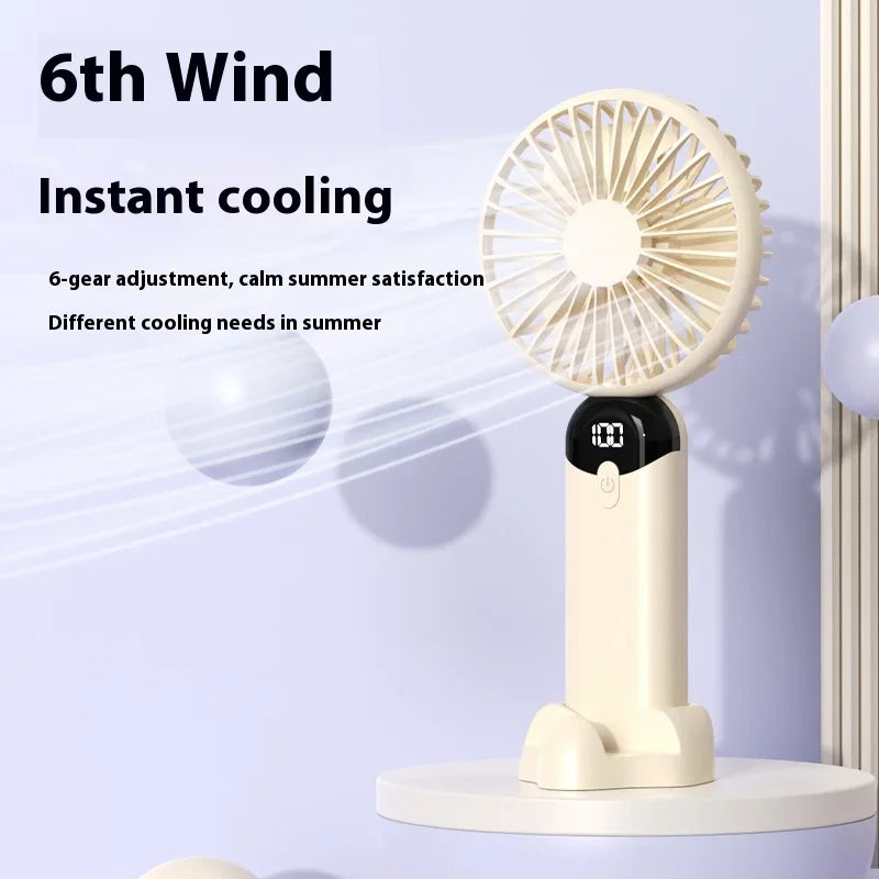 Portable fan with '6th Wind' text and cooling features on a light blue background